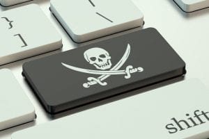 software piracy concept, on the computer keyboard